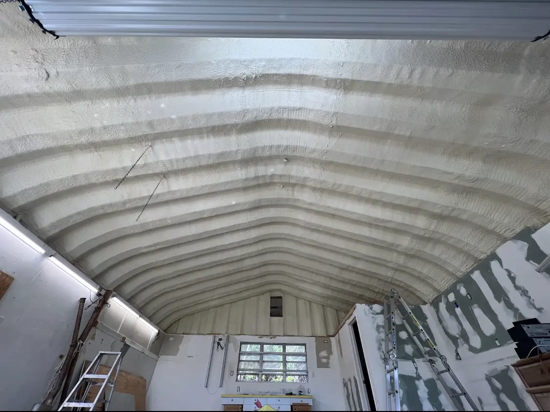 Spray polyurethane foam applied to the underside of a metal roof deck in Torrance